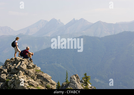 Senior couple enjoying the view of the Lizard Range near Fernie, British Columbia, Canada. Stock Photo