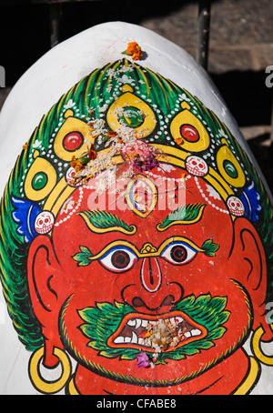 Close up of painted face on temple
