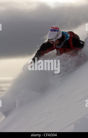 A male skier makes powder turns in the Sunshine Village Backcountry, Banff, AB Stock Photo