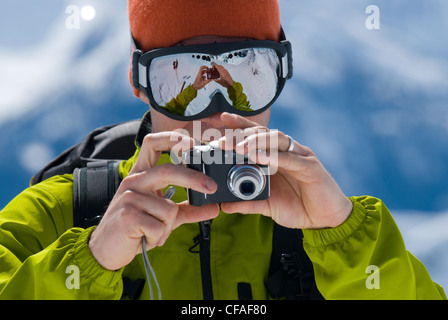 Middle-aged man using digital camera, British Columbia, Canada. Stock Photo