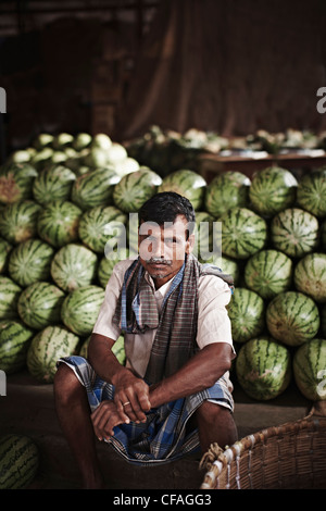 Vendor selling watermelons in market Stock Photo