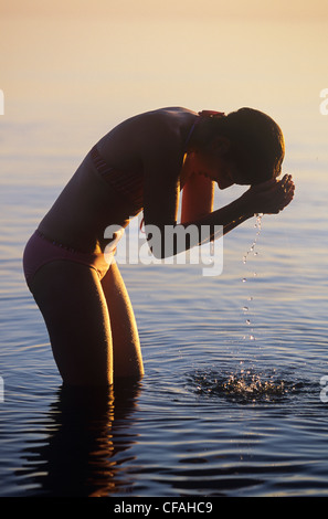 Woman bathing in Gros Morne National Park, Newfoundland and Labrador, Canada. Stock Photo