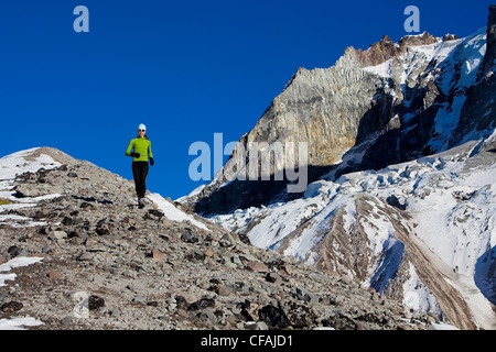 Woman trail running on Brohm Ridge near Squamish, British Columbia, Canada. Stock Photo