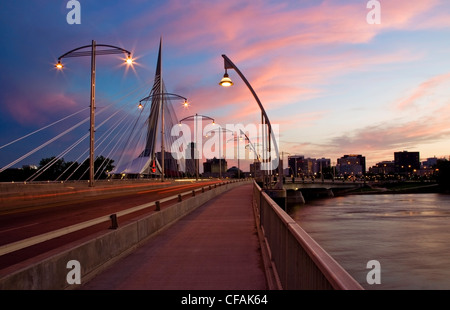 Winnipeg skyline with Esplanade Riel and Provencher Bridge over Red River at night, Winnipeg, Manitoba, Canada. Stock Photo