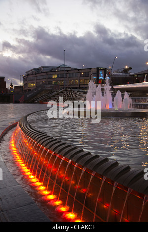 Sheffield train station at night with illuminated fountains and water feature South Yorkshire England Stock Photo