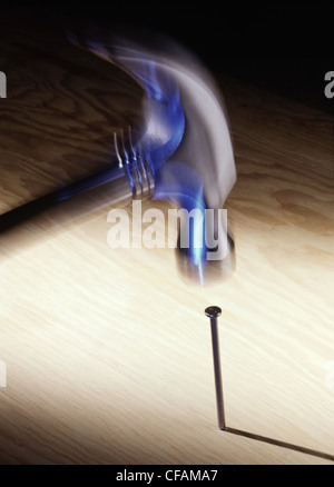 hammer hitting a nail in movement, Montreal, Quebec, Canada Stock Photo
