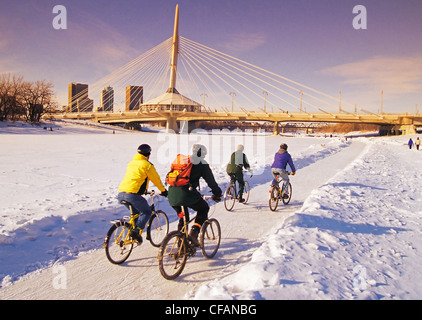 Group people cycling along Winnipeg River Trail Stock Photo