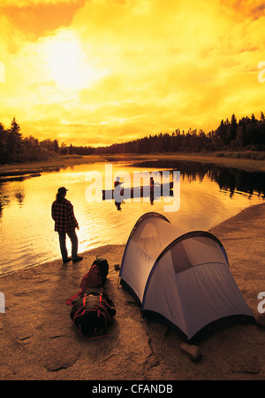 Family camping, canoeing and fishing, Whiteshell Provincial Park, Manitoba, Canada Stock Photo