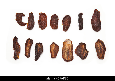 Sun dried tomato's isolated on a white studio background. Stock Photo
