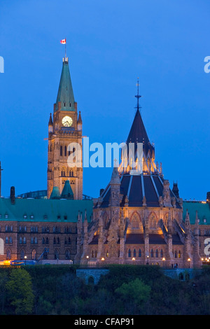 View of Parliament Hill seen from Nepean Point at dusk in the city of Ottawa, Ontario, Canada Stock Photo