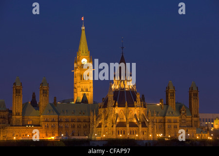 View of Parliament Hill seen from Nepean Point at dusk in the city of Ottawa, Ontario, Canada Stock Photo
