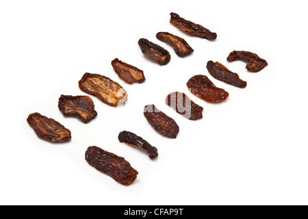 Sun dried tomato's isolated on a white studio background. Stock Photo