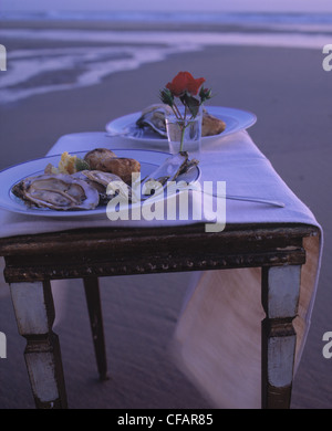 Still: lovers dinner on the beach Stock Photo