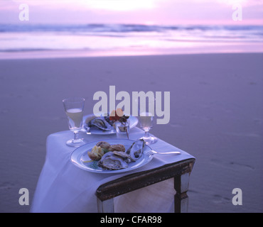 Still: lovers dinner on the beach (oyster) Stock Photo