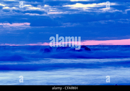 Waves breaking over rocks, Presqu'ille, Cape Breton Highlands National Park, Nova Scotia, Canada. Stock Photo