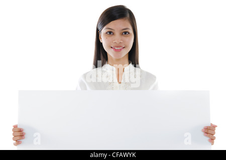 Mixed race Asian woman holding a white board Stock Photo