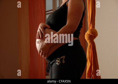 Pregnant, belly, 9-th month, pregnancy, woman, nude, fur Stock Photo