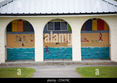 Looking through arches at beach scene painted on building at Hamworthy Park, Poole, Dorset UK  in June Stock Photo