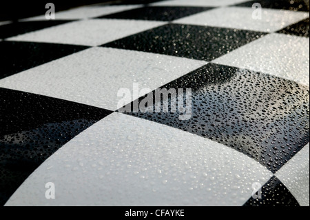 Black & white checkerboard car roof with raindrops Stock Photo