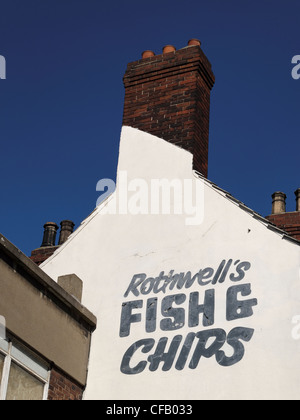 A sign advertising a Fish and Chip shop in the centre of Doncaster, South Yorkshire, England. Stock Photo