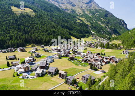 small swiss village settlement in green deep wooded valley in canton Valais Switzerland Stock Photo