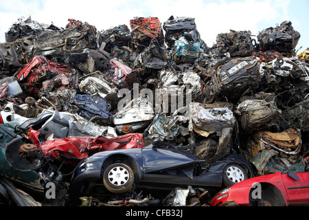 piles of crushed scrapped cars at metal recycling site Belfast Northern Ireland UK Stock Photo