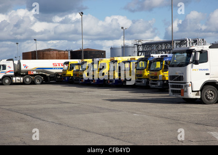 row of petrol and fuel tankers in oil storage terminal Belfast harbour Northern Ireland UK Stock Photo