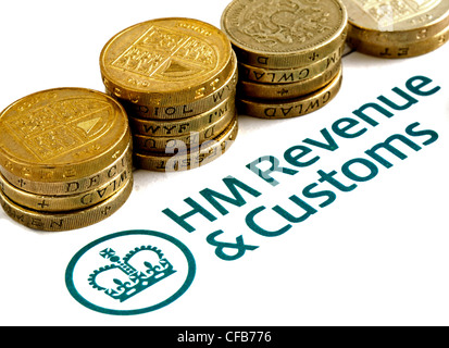 HM Revenue & Customs tax Return form and coins Stock Photo