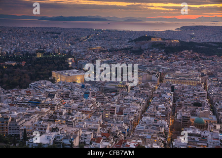 Athens skyline aerial view in the afternoon with the lights over blue hour, Syntagma, Greek Parliament and Parthenon are visible Stock Photo