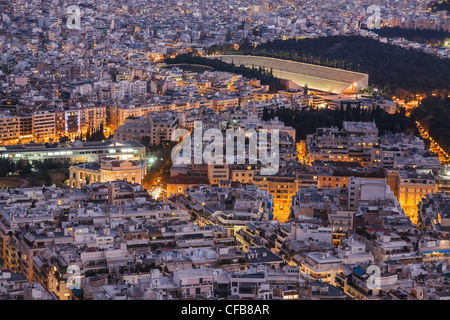 Athens skyline aerial view in the afternoon with the lights over blue hour, Kallimarmaro Stadium is visible Stock Photo