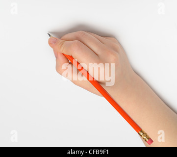 Hand with pencil. Over grey empty a paper. Imitation to write Stock Photo