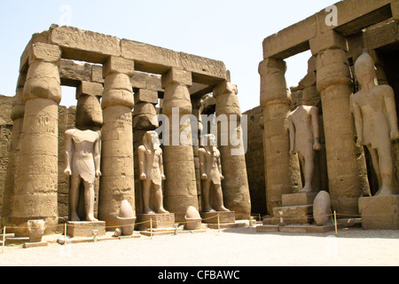 Columns and statues of the great temple of Karnak dedicated to the worship of Amun, in the city of Luxor in Egypt Stock Photo