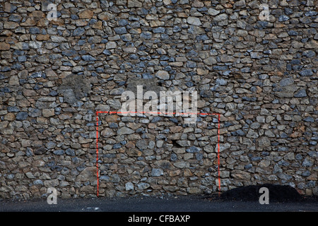 A goal painted on an old wall in the centre of the small French of Talairan, France Stock Photo