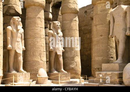 Columns and statues of the great temple of Karnak dedicated to the worship of Amun, in the city of Luxor in Egypt Stock Photo