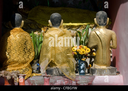 Gold Buddha statues form an display at a Buddhist temple in Pai, Thailand. Stock Photo