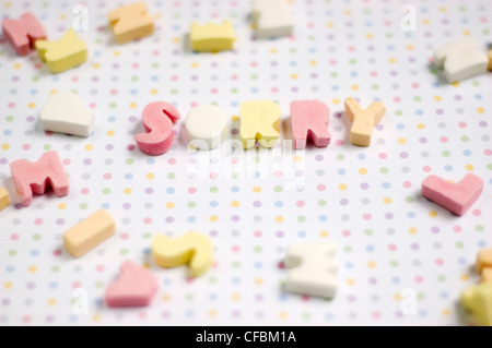Sugar letter shaped sweets spelling the word sorry Stock Photo