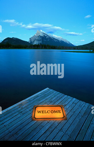 Dock with welcome mat by Vermilion Lakes, Banff National Park, Alberta, Canada Stock Photo