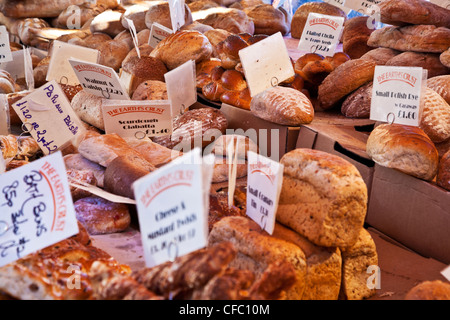 Speciality breads on a bakery stall in the Market Square, Cambridge, England, UK Stock Photo