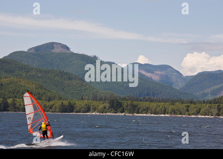 A windsurfer on Nitinat Lake, Vancouver Island, BC Stock Photo