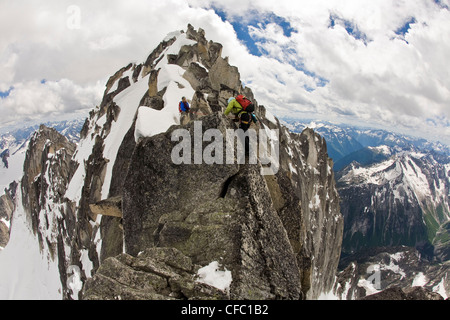 Two female climbers ascend the Northeast Ridge - North Howser, Bugaboos, BC Stock Photo