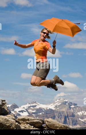 A female hiker being silly in Sunshine Meadows, Banff National Park, AB Stock Photo
