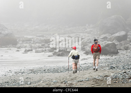Two senior citizens hike along shores Mystic Stock Photo