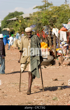 One legged man on crutches in The market in Bhar Dar in Ethiopia Stock Photo