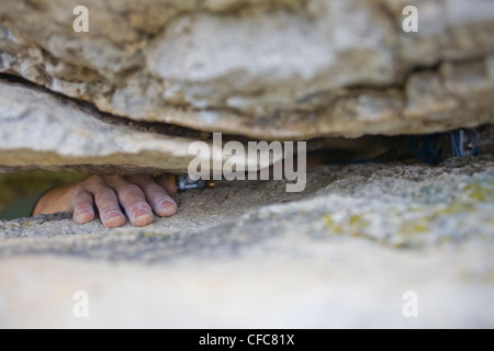 A young man climbs the Abyss 5.10b, Rattle Snake Point, ON Stock Photo