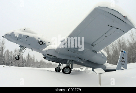 An A-10 Thunderbolt static display at Heritage Park tips backward from the weight of snow on its tail March 6, 2012, Eielson Air Force Base, Alaska. Eielson received more than 8 inches of snow in the past week. Stock Photo