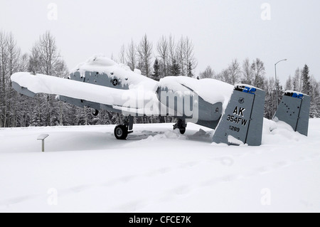 An A-10 Thunderbolt static display at Heritage Park tips backward from the weight of snow on its tail March 6, 2012, Eielson Air Force Base, Alaska. Average snowfall for March usually exceeds 7 inches each year. Stock Photo