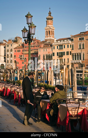 People at a restaurant terrace by the Grand Canal - Venice, Venezia, Italy, Europe Stock Photo