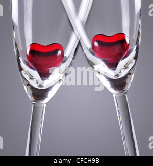 Red jelly hearts in champagne flutes, grey background Stock Photo