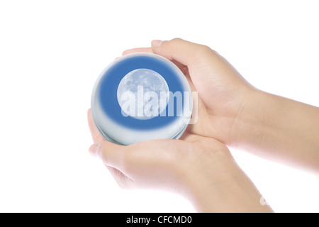 Children's hands on the world. Stock Photo