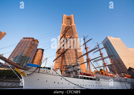 Japan, Tokyo, Yokohama, Landmark Tower Building and Nippon Maru Sail Training Ship Stock Photo